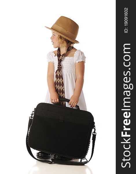 Profile of an adorable preschooler waiting to go to work with her grandpa. She's holding a computer case while wearing a sundress and an old-style felt hat, wide tie and men's shoes. Isolated on white. Profile of an adorable preschooler waiting to go to work with her grandpa. She's holding a computer case while wearing a sundress and an old-style felt hat, wide tie and men's shoes. Isolated on white.