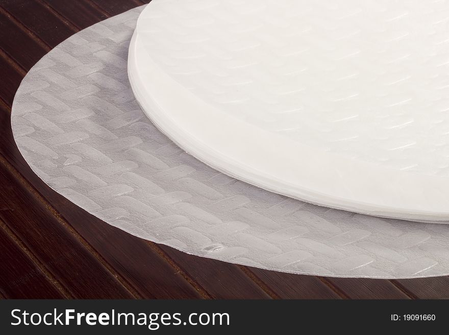 White rice paper on a wooden table.