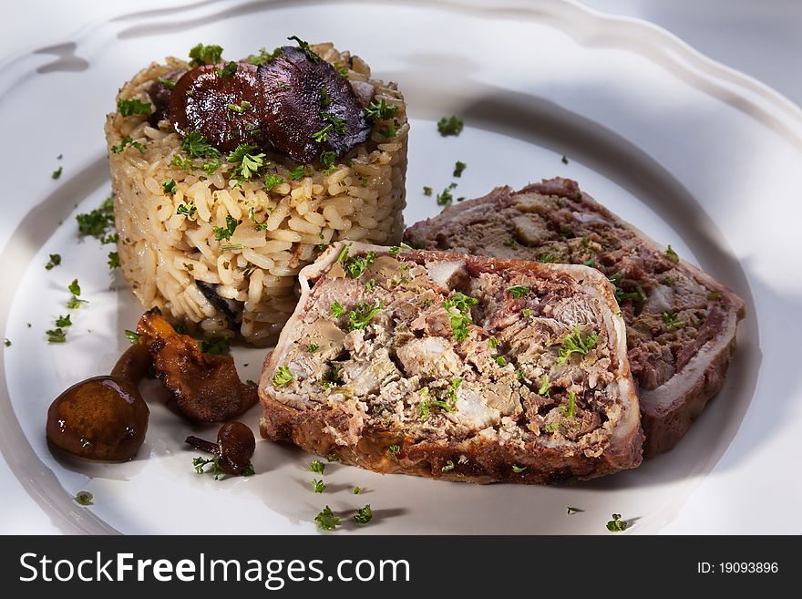 Rustic liver pasty with risotto on a plate