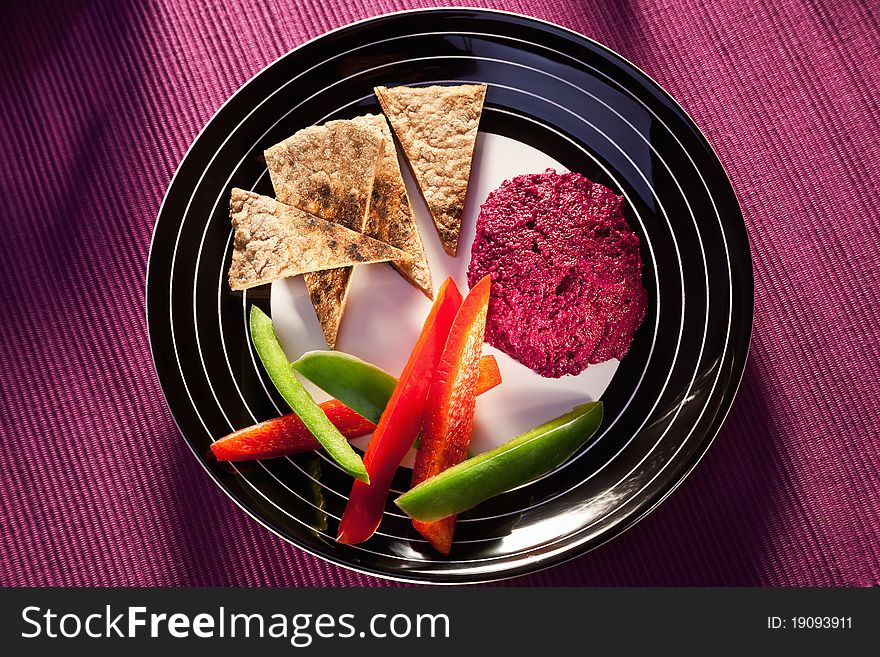 Beetroot humus with whole wheat pita bread and vegetables