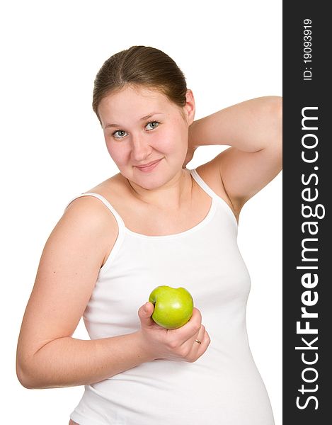 Young pregnant woman with apple over white. Young pregnant woman with apple over white