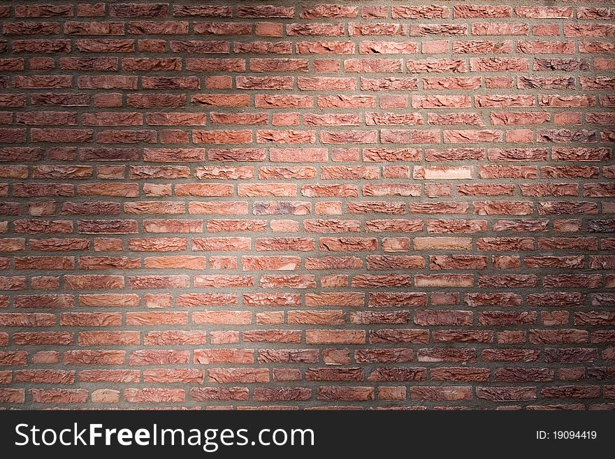 Brick Wall With Flush Joints In Dramatic Lighting