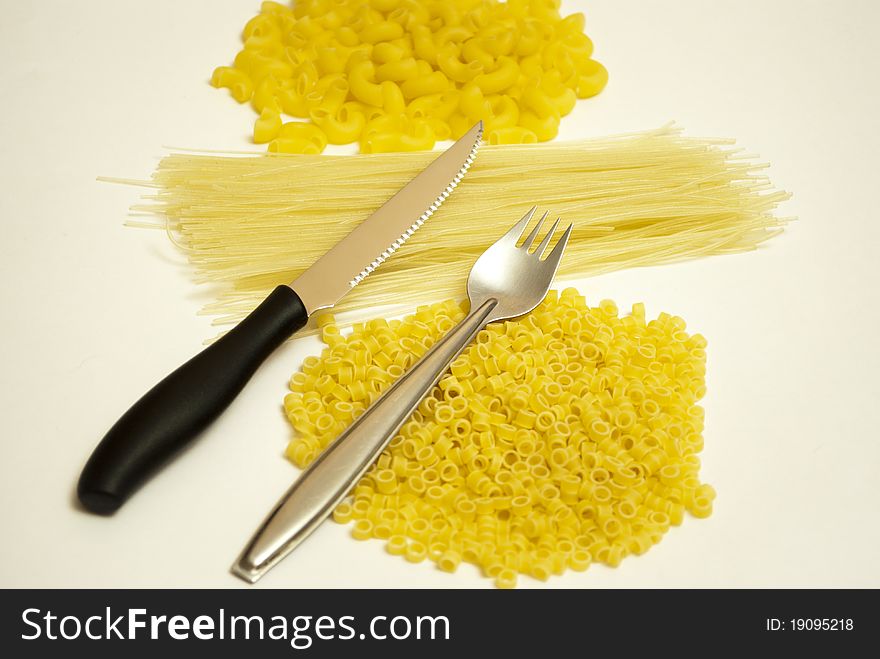 Flour products macaroni and tablewares a knife and a plug. Flour products macaroni and tablewares a knife and a plug