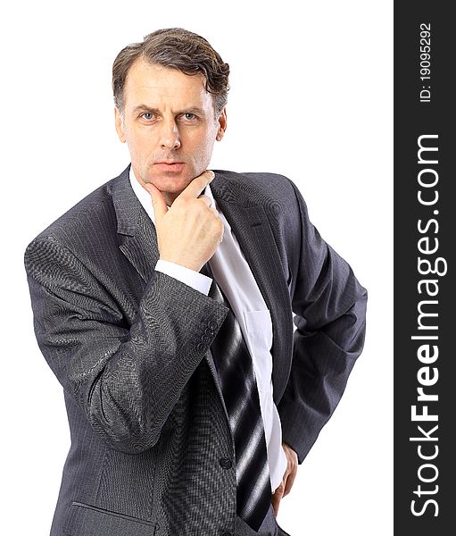 Portrait of a successful mature business man standing with folded hand on white background. Portrait of a successful mature business man standing with folded hand on white background