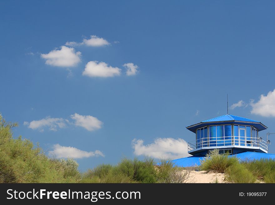 House and little grass at sky.