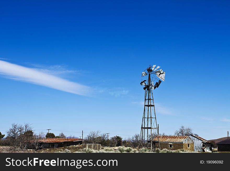 Deserted Farm In Windswept Desert