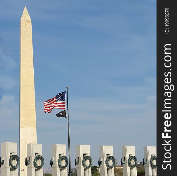 World War II memorial in washington DC with the washington monument standing tall. World War II memorial in washington DC with the washington monument standing tall