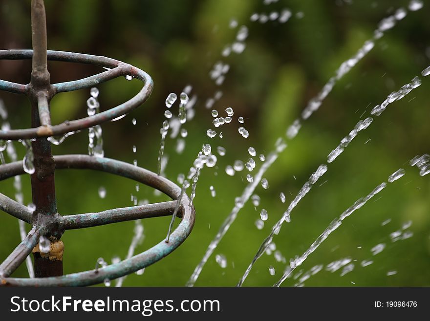 Old twisted water fountain from a pond. Old twisted water fountain from a pond