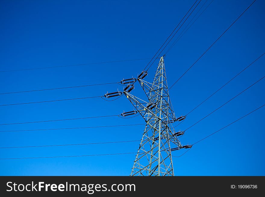 Electrical pylon silhouette and clear blue sky. Electrical pylon silhouette and clear blue sky