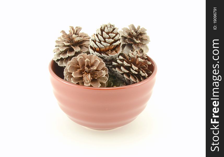 Pitch Pine Cones in a Brown Bowl. Pitch Pine Cones in a Brown Bowl