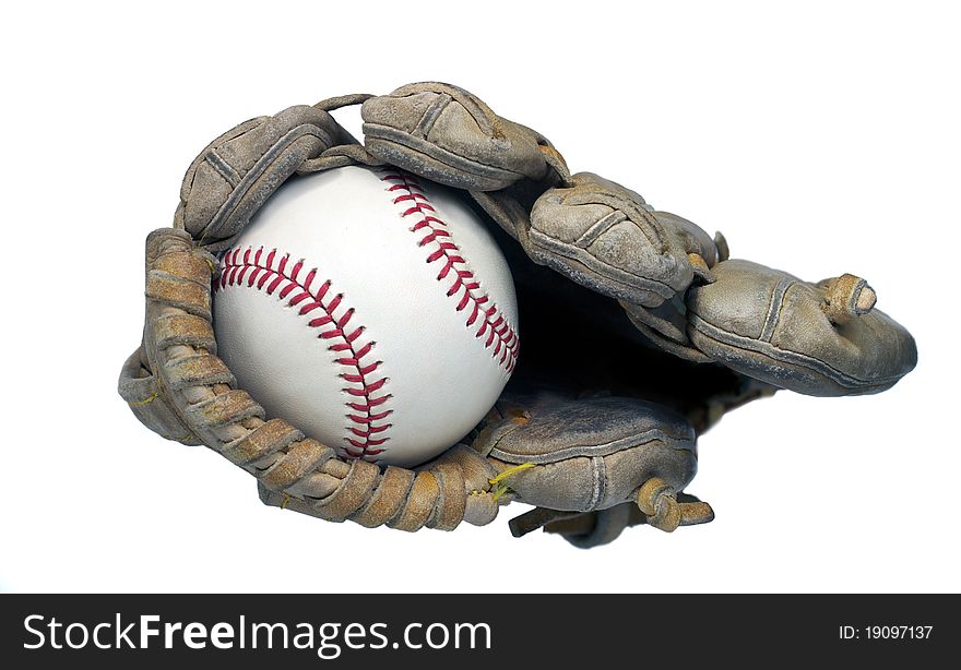 View of a hardball in the end of a baseball mitt. View of a hardball in the end of a baseball mitt