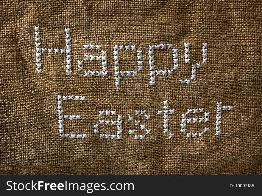 Words 'Happy Easter' embroidered on the old sack