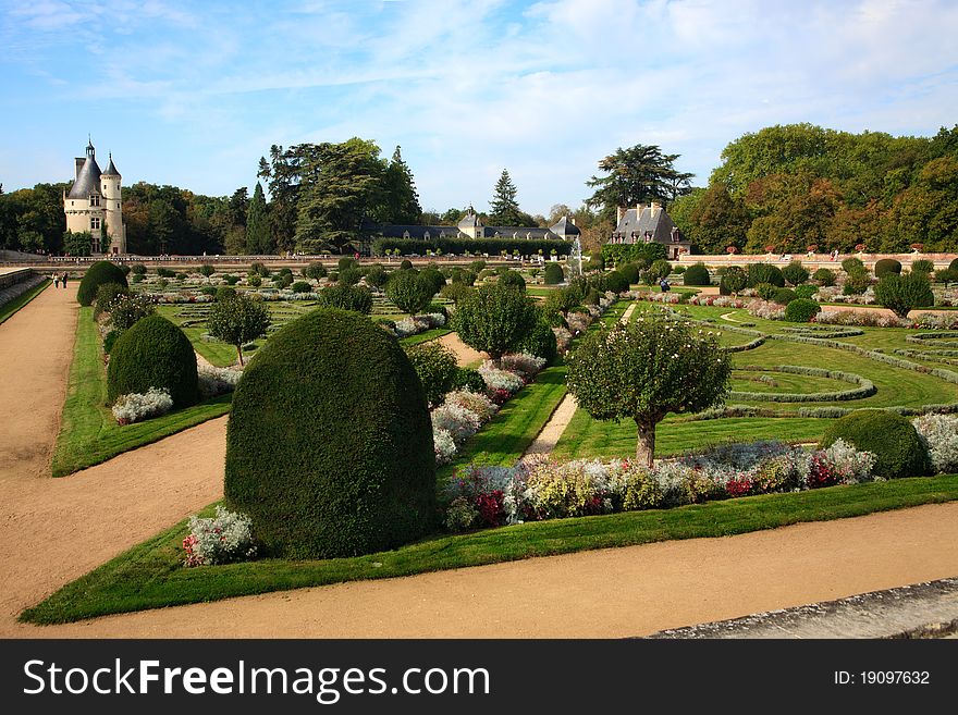 The formal gardens, with flowers, trees and sculpted bushes, at Chateau Chenonceau, Loire Valley, France. The formal gardens, with flowers, trees and sculpted bushes, at Chateau Chenonceau, Loire Valley, France