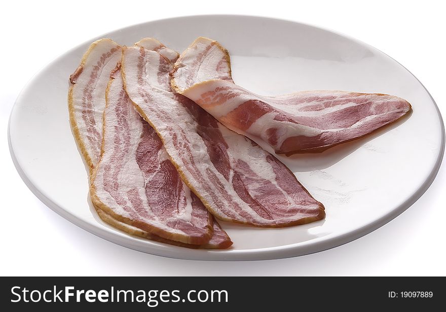 Some slices of bacon on the plate