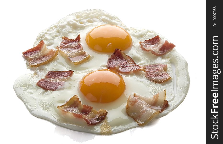 Fried eggs with bacon on the white