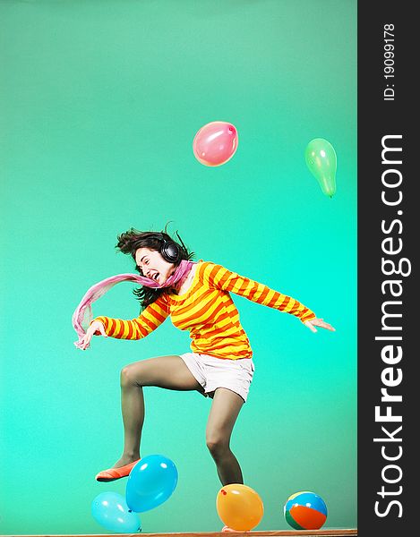 Jumping Happy Girl With Balloons