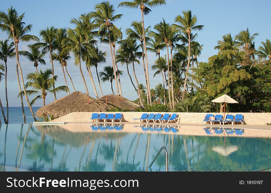 Chairs near a pool in the tropics. Chairs near a pool in the tropics