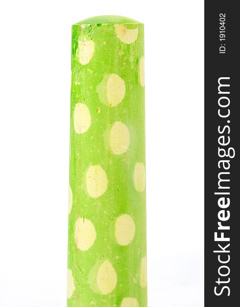 Stick of lime green polka dot chalk