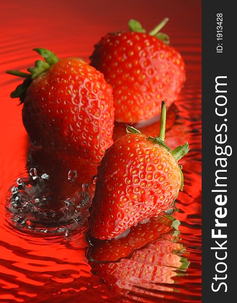 Strawberry, water and mirror surface. Strawberry, water and mirror surface