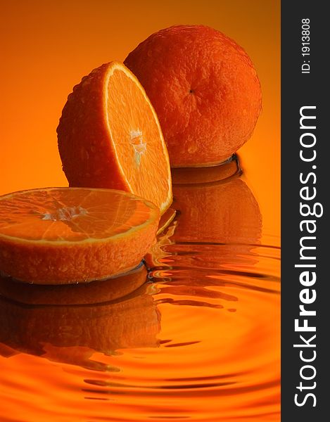 Orange, water and mirror surface. Orange, water and mirror surface