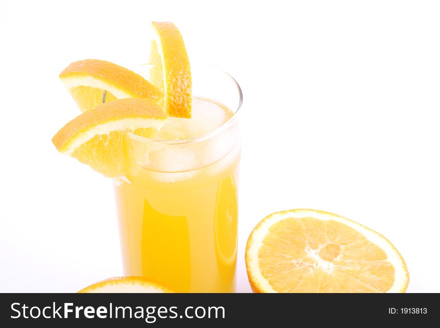 Orange juice and half-cut oranges isolated on white