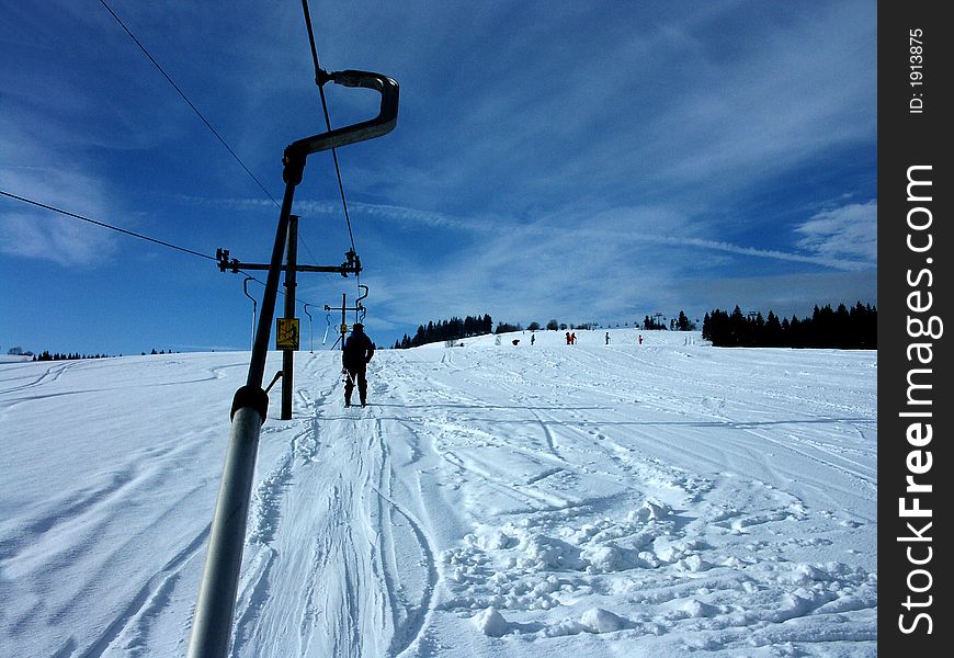 Drive skier a ski lift. Drive skier a ski lift
