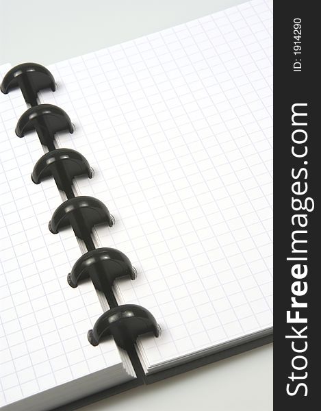 Close up of  blank notebook isolated one a grey background