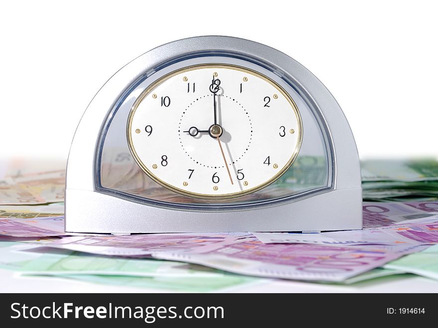 Chrome clock with euro bills over white background. Chrome clock with euro bills over white background