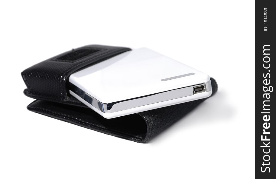 Disk drive with leather case over white background. Disk drive with leather case over white background