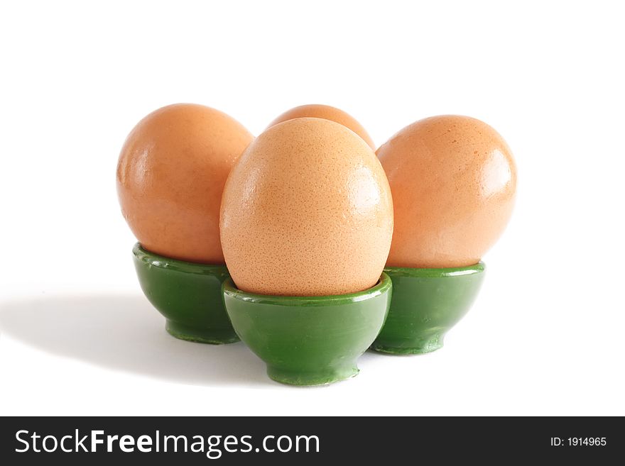 Four eggs in their egg-cup. Four eggs in their egg-cup