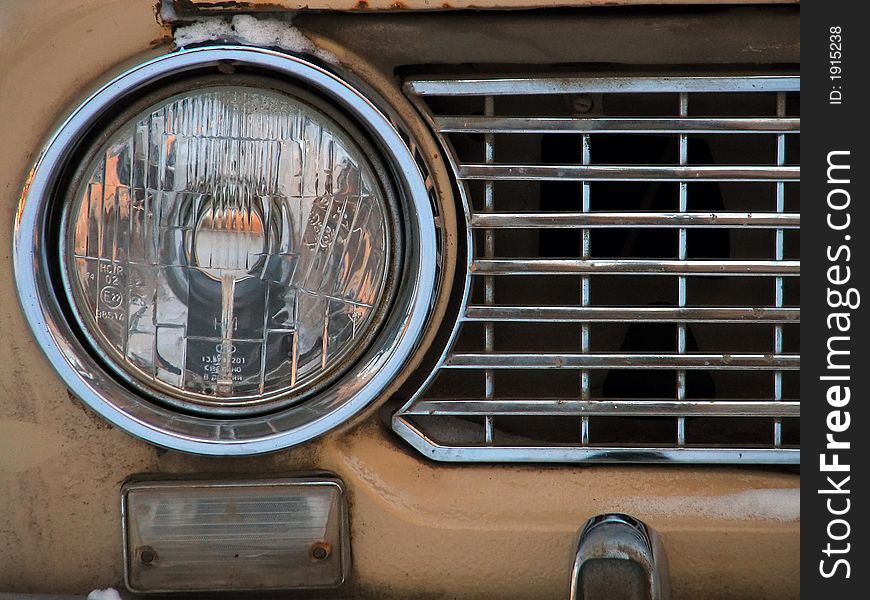 Headlight of a yellow car. Headlight of a yellow car