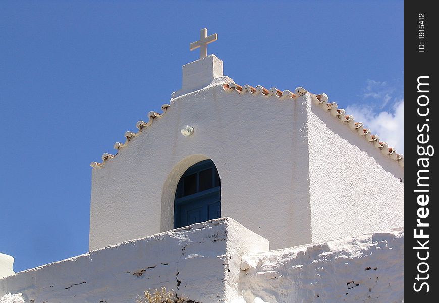 A simple white painted church in Greece. A simple white painted church in Greece.