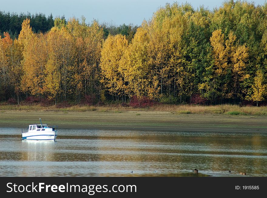 Autumn Lake Scene With Boad