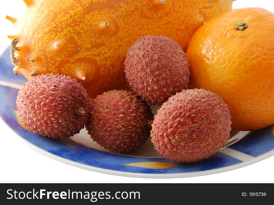 Fresh tropical fruit on a plate. Fresh tropical fruit on a plate