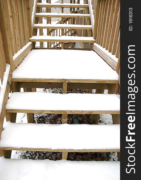 Stair covered with white snow all over