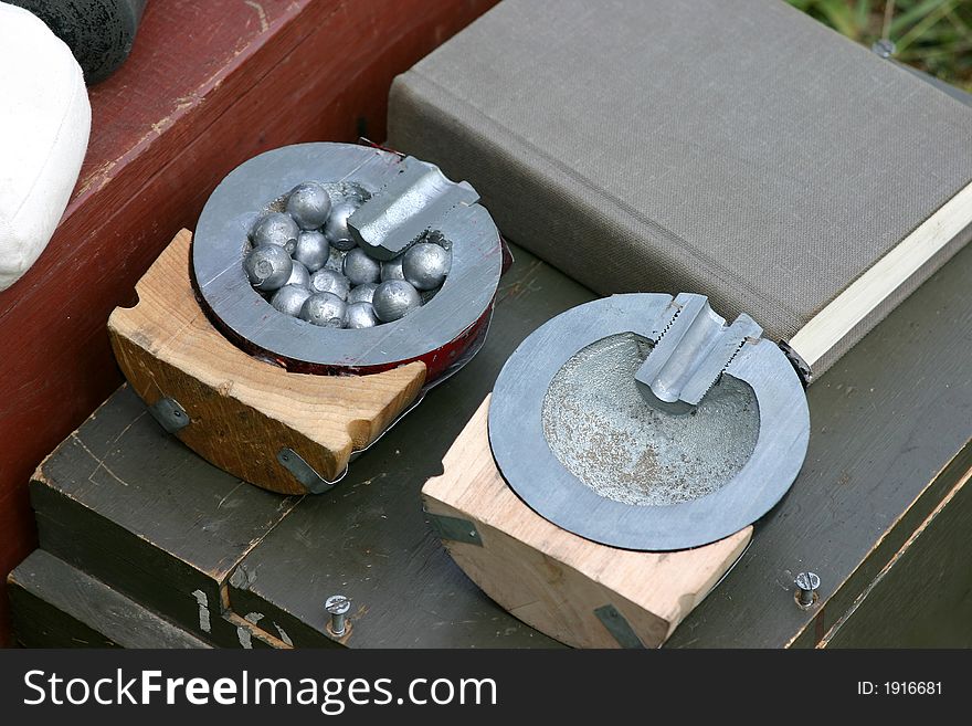 Cutaway of reproduction civil war cannon balls and books. Cutaway of reproduction civil war cannon balls and books