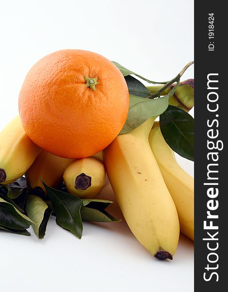 Fresh bananas and orange on white background (fruits, food, vitamin)