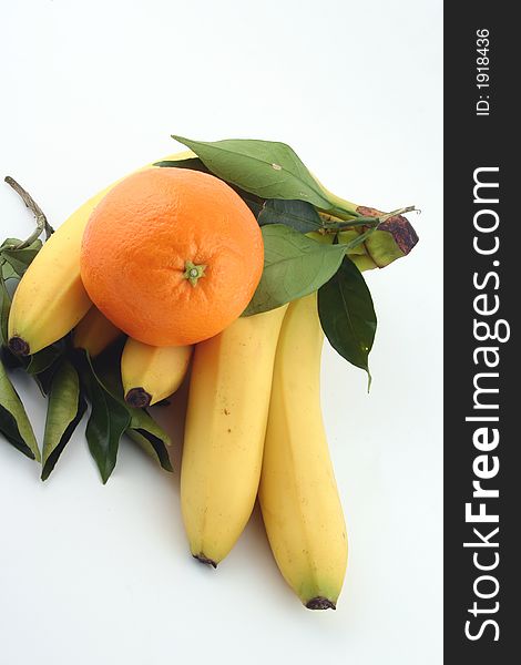 Fresh bananas and orange on white background (fruits, food, vitamin)