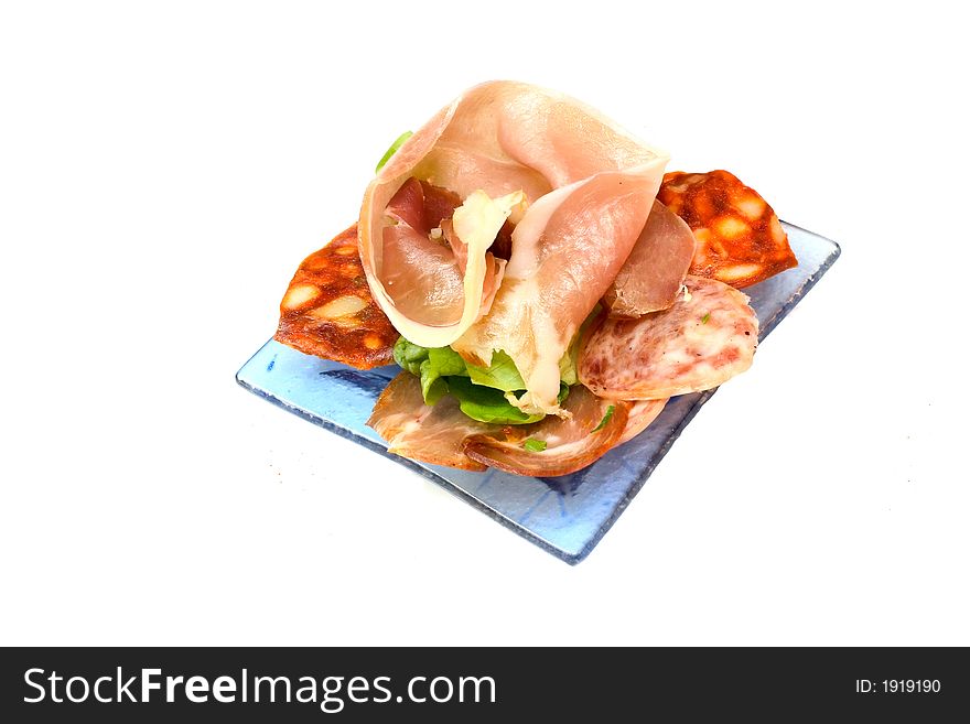 Ham aperitif on white background