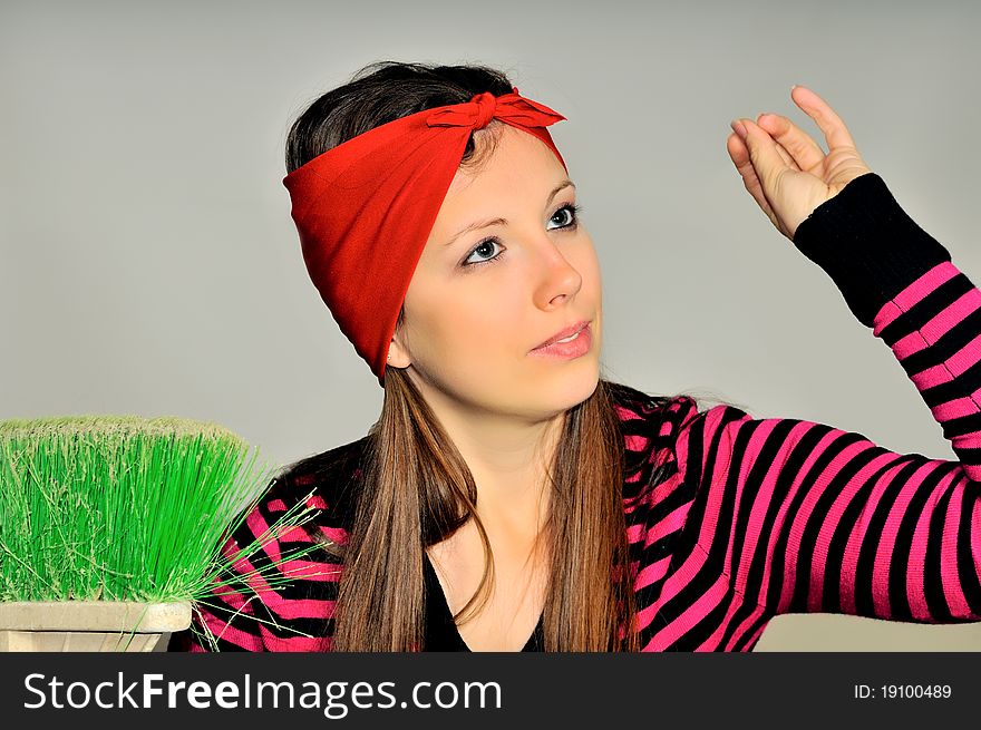 Girl with a red handkerchief on his head preparing to clean the apartment. Girl with a red handkerchief on his head preparing to clean the apartment