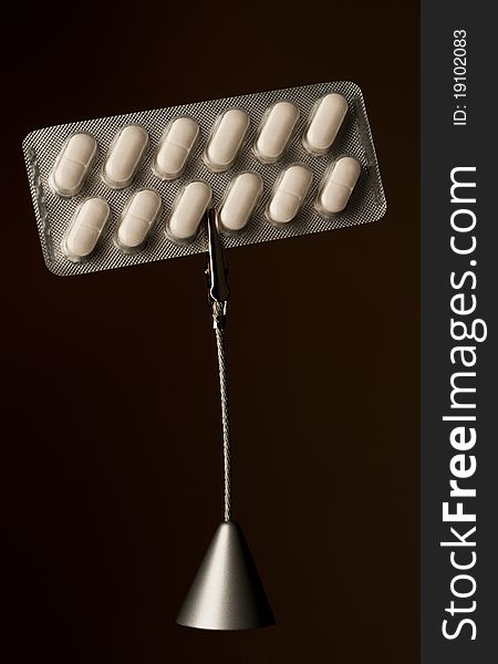 Memo holder with pills in blister on dark background. Memo holder with pills in blister on dark background