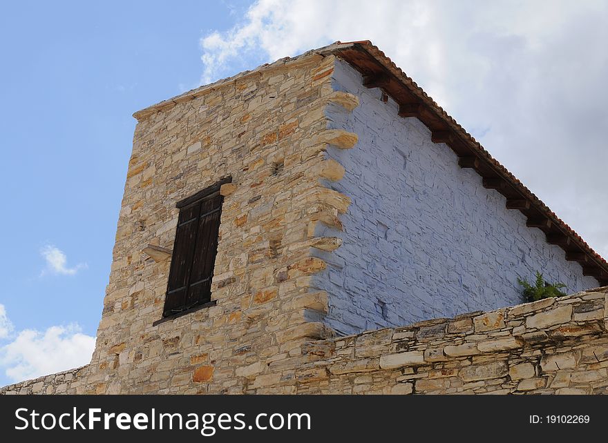 Old traditional house exterior from a village in Cyprus. The house wall is made of clay bricks. Old traditional house exterior from a village in Cyprus. The house wall is made of clay bricks