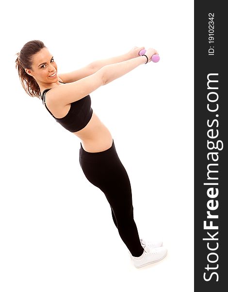 A young female performing an exercise with weights on an isolated white background. A young female performing an exercise with weights on an isolated white background