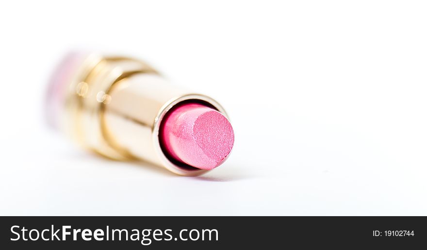 Open pink lipstick closeup isolated