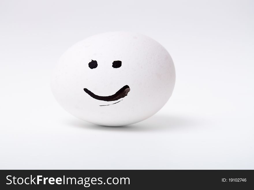 One white smiling egg closeup