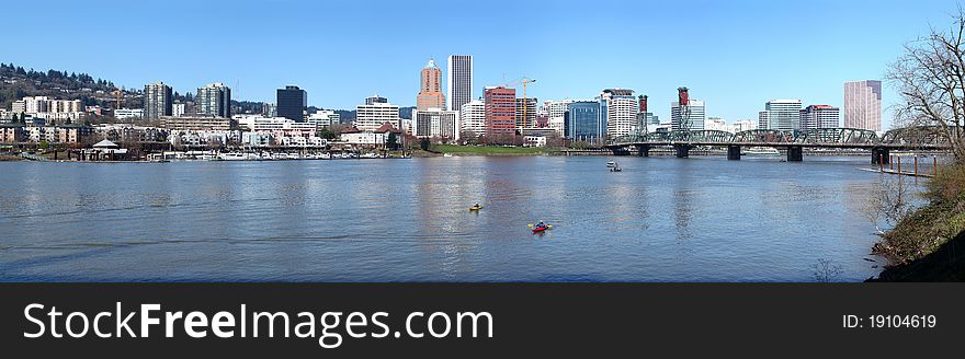 Kayaks on the Willamette river with the panorama of Portland OR. Kayaks on the Willamette river with the panorama of Portland OR.