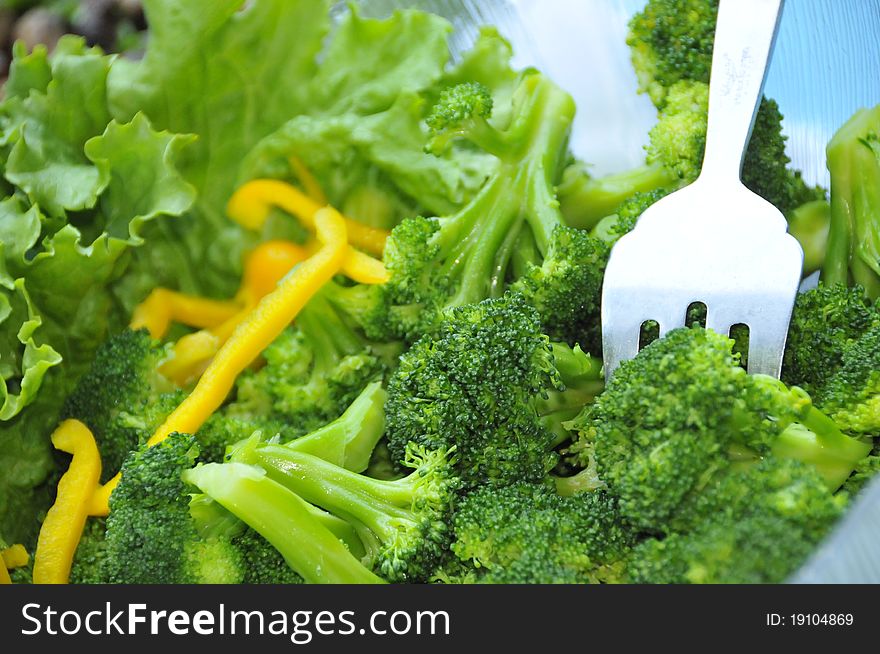 Traditional Organic Broccoli Salad with Fancy Garnish and Serving Utensil. Traditional Organic Broccoli Salad with Fancy Garnish and Serving Utensil