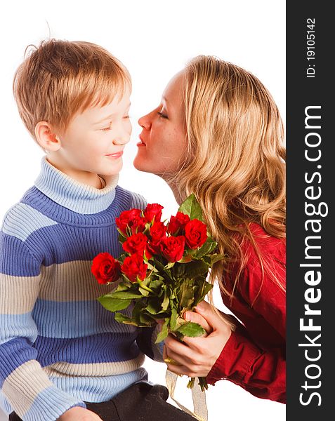 Charming  beautiful young woman with a son and with the bouquet of red roses on a white background
