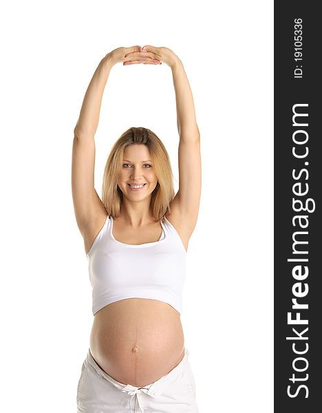 Pregnant woman practicing yoga isolated on white