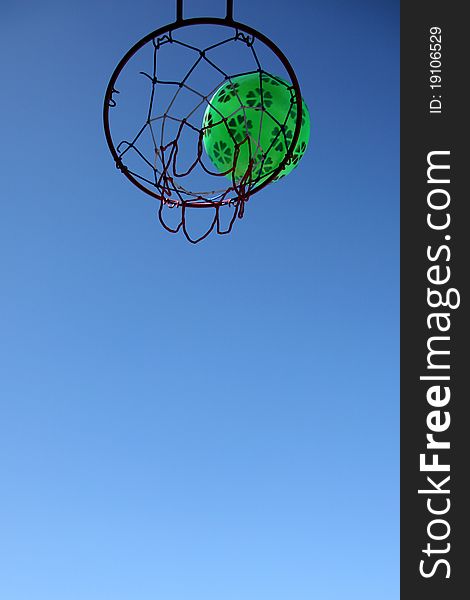 Basketball Hoop And Green Ball